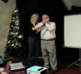 Andrew Cole plays harmonica for Xmas carols